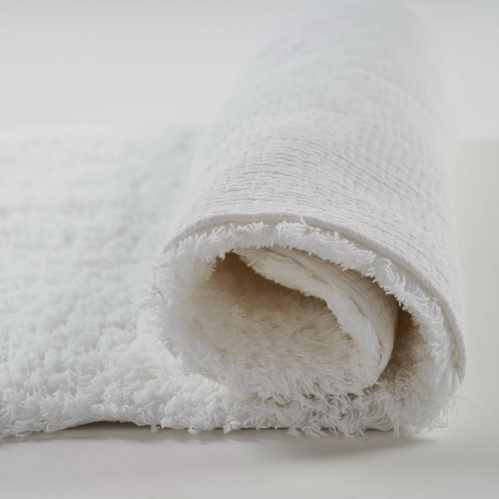 rolled up 100% cotton bath mat